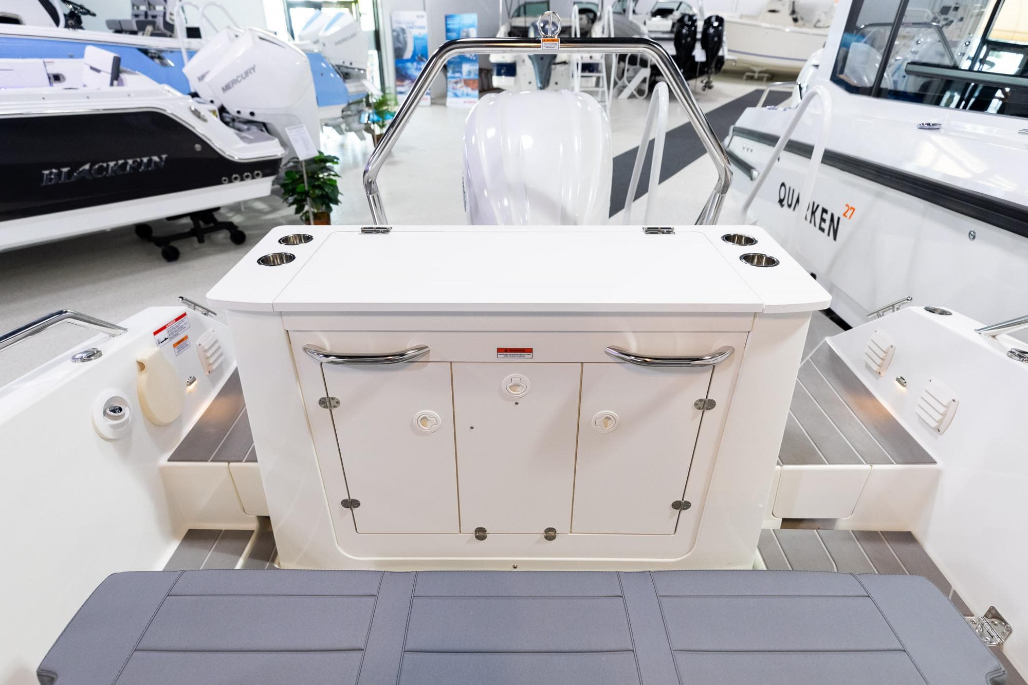 2024 Quarken 27 T-Top V2 boat interior with storage and seating.