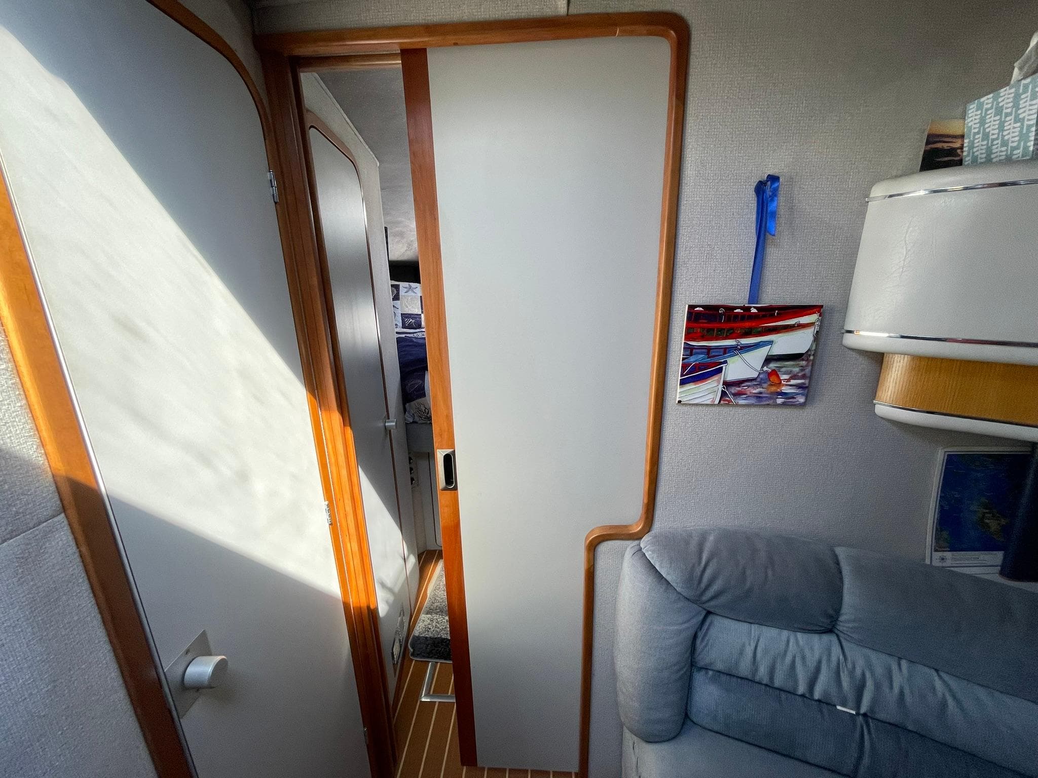 Interior of 1989 Sea Ray 420 yacht with cozy seating and modern decor.