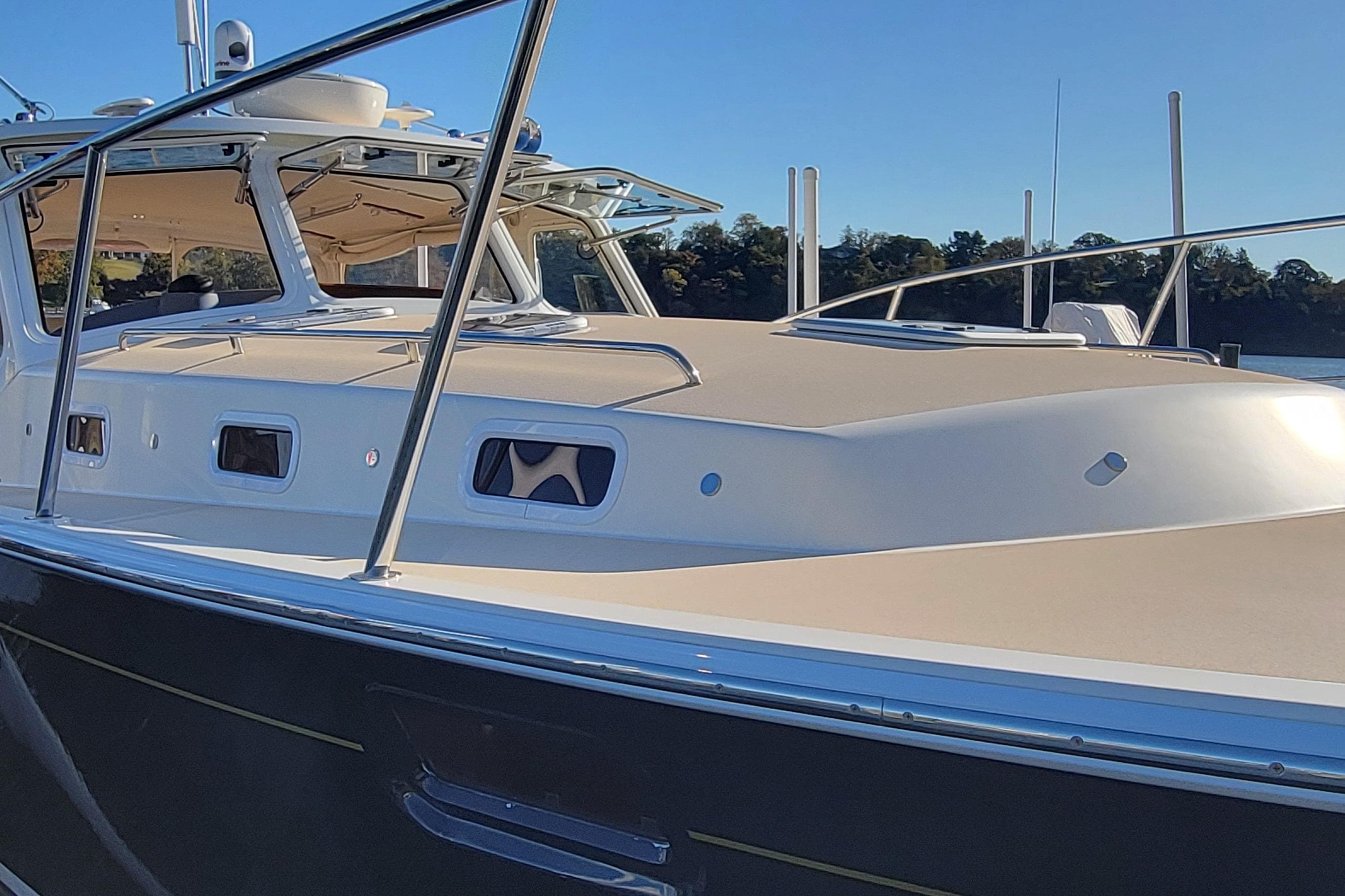 2017 MJM 40z Downeast boat with sleek design and modern features on a sunny day.