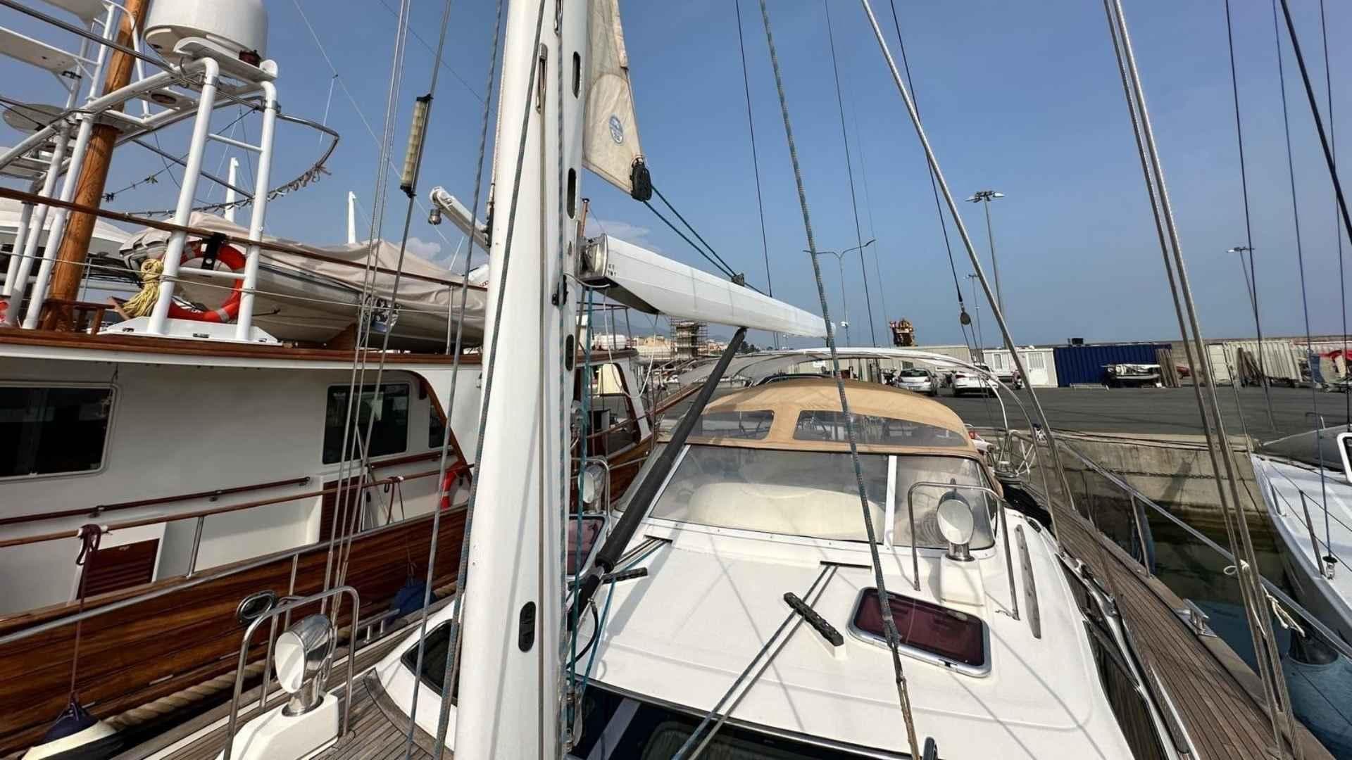 Sailboats docked at a marina, featuring a 2004 Moody 64 model.
