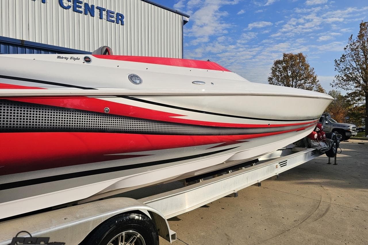 2008 Donzi 38 ZR speedboat with red and white design on a trailer.