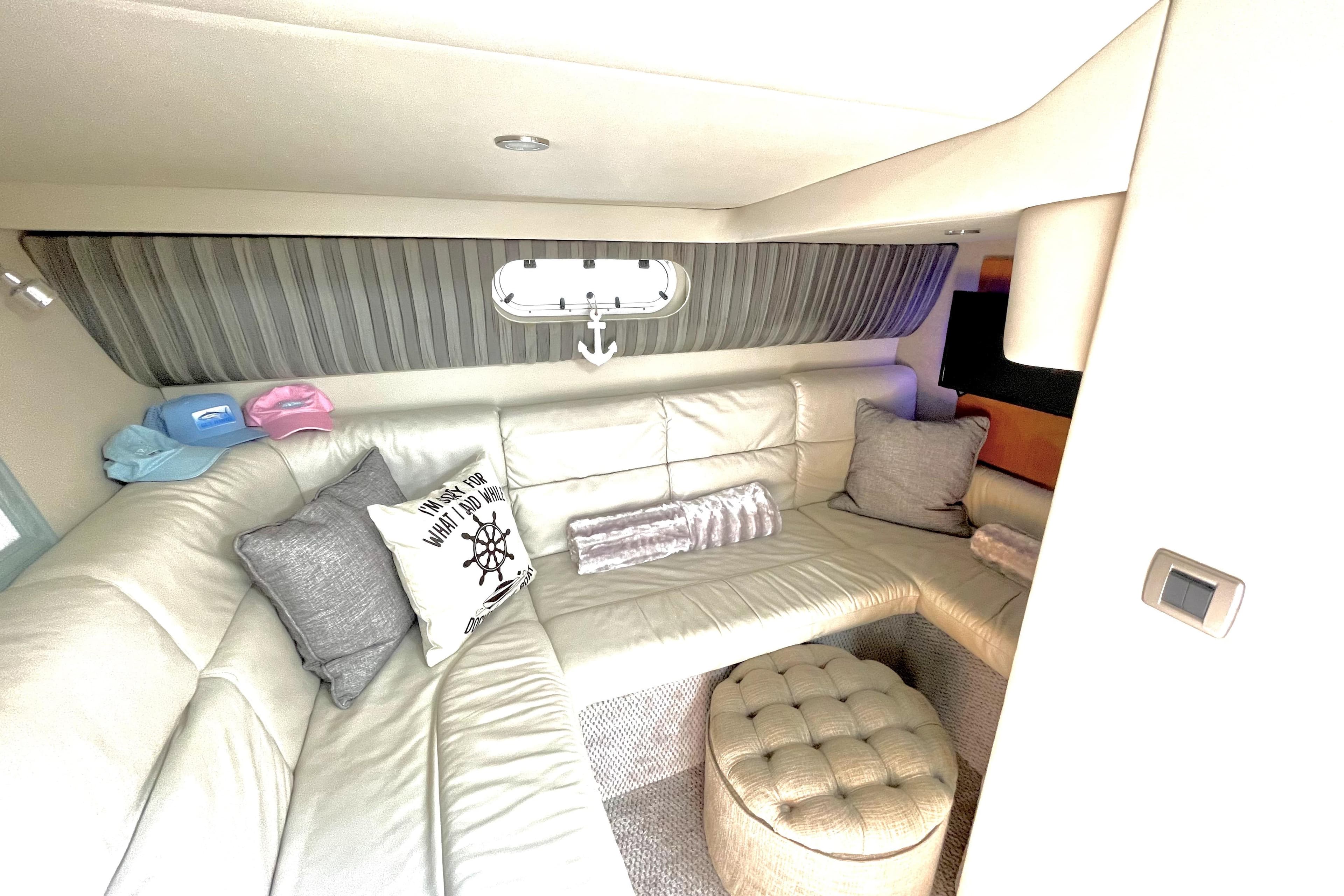 Luxurious interior of a 2006 Formula 37 Performance Cruiser with plush seating and nautical decor.