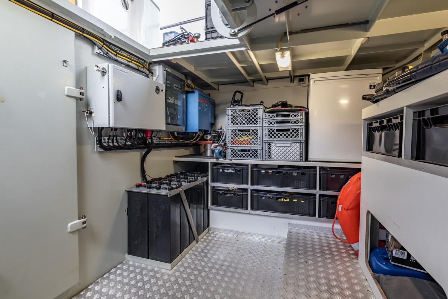 Engine room of 2013 Sturier 620 OC yacht with organized storage and equipment.