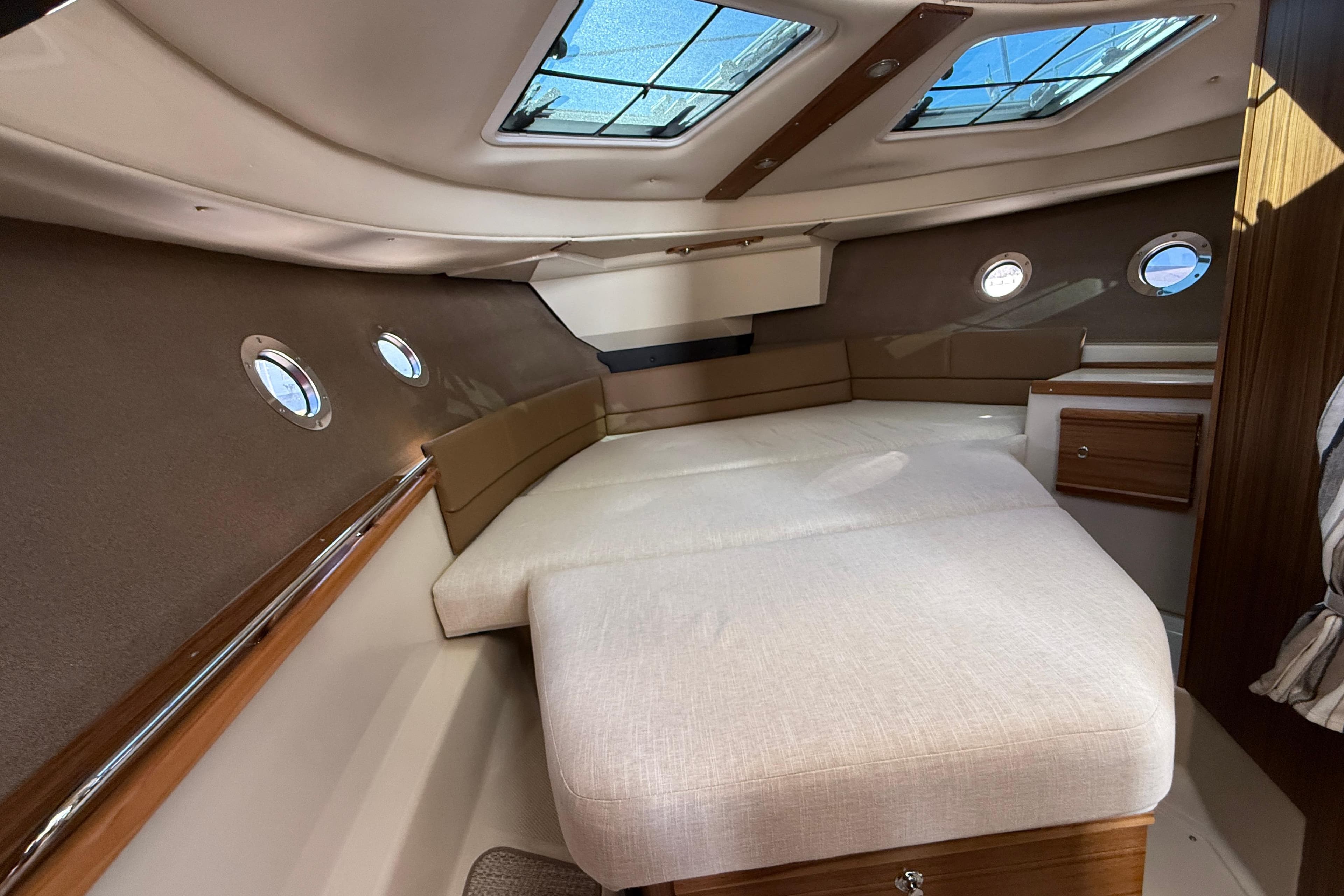 2026 Ranger Tugs R-29 CB cabin interior with skylights and portholes.