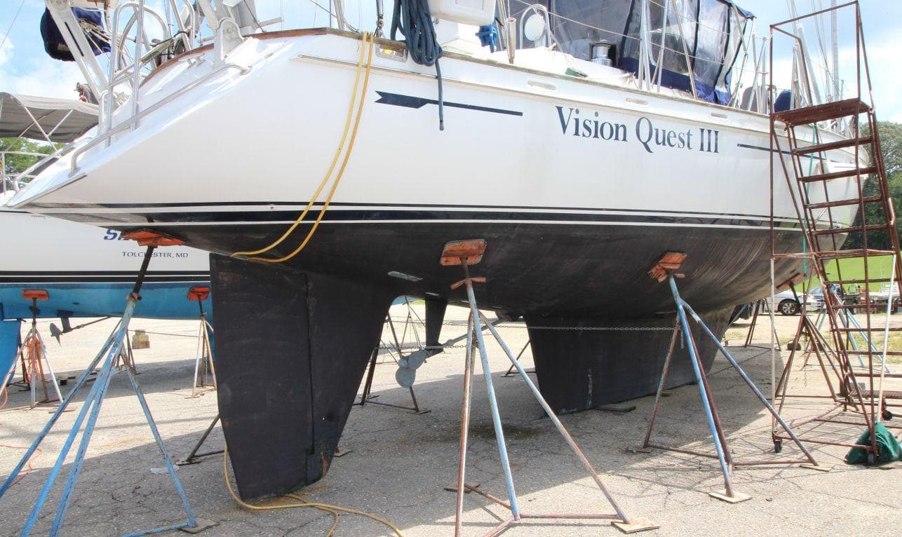 1988 Tayana 52 sailboat "Vision Quest III" on dry dock with support stands.