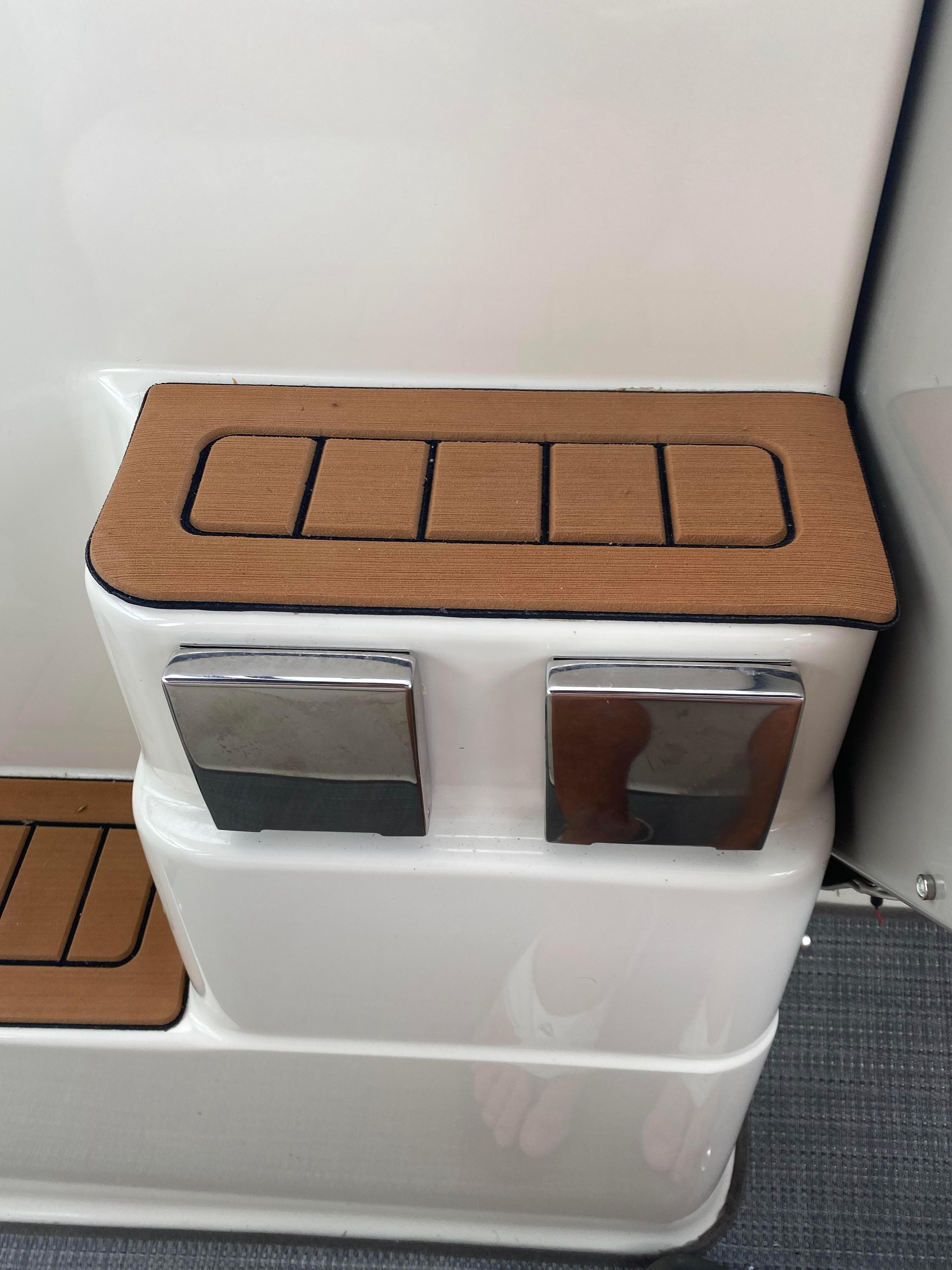 Maxum 3200 SCR 1997 boat steps with wood trim.