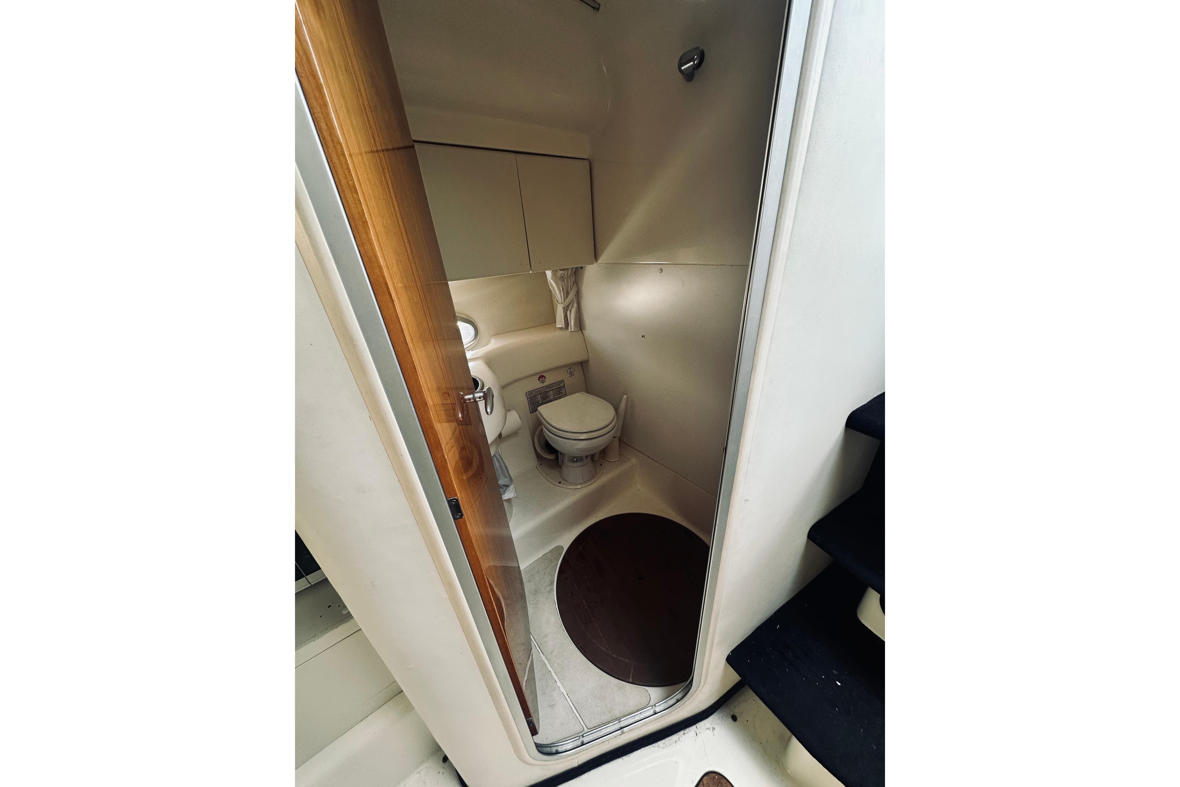 Bathroom interior of 1999 Cranchi Endurance 39 yacht, featuring compact design and modern fixtures.