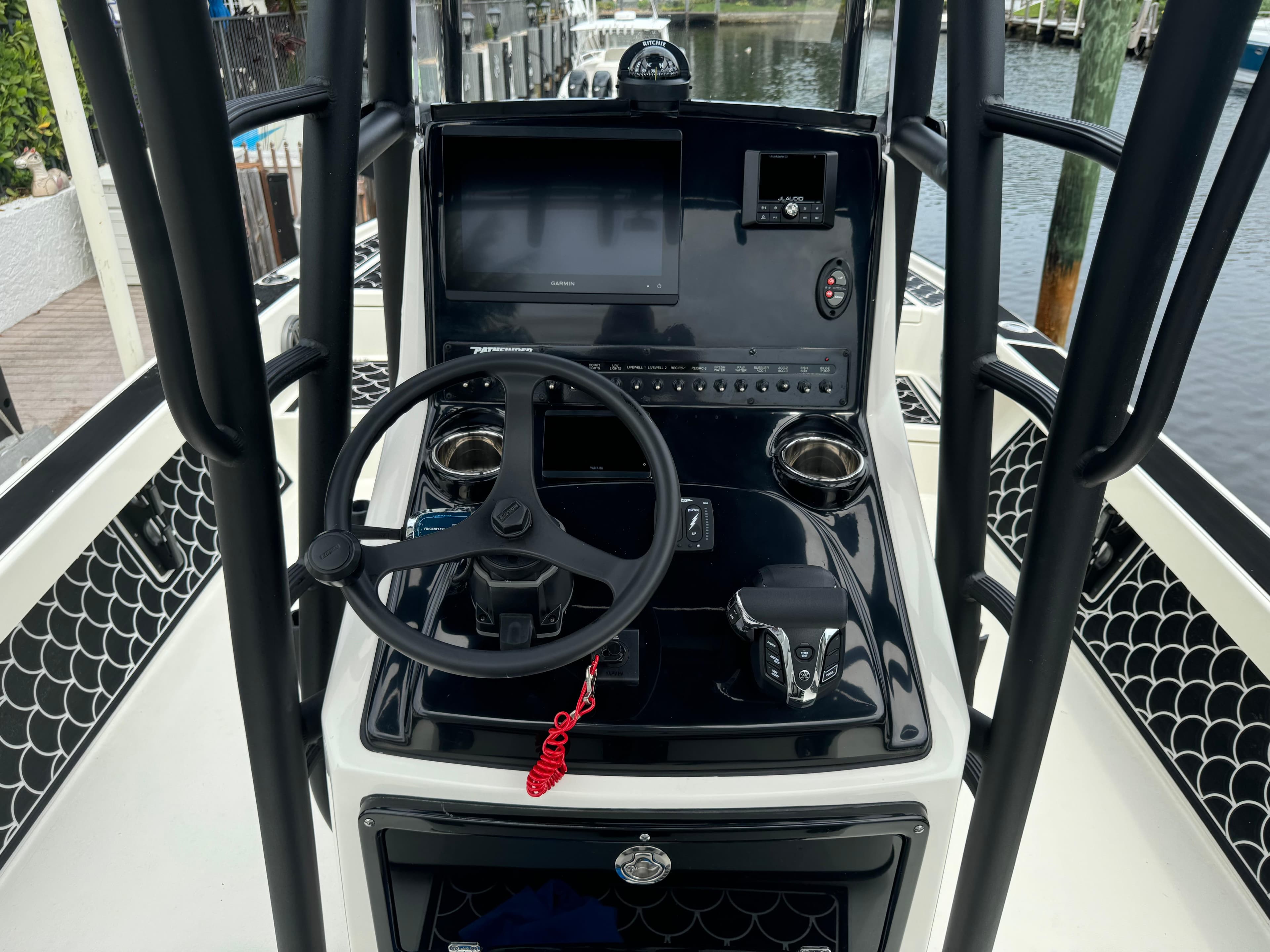 2024 Pathfinder 2500 Hybrid boat console with steering wheel and controls.