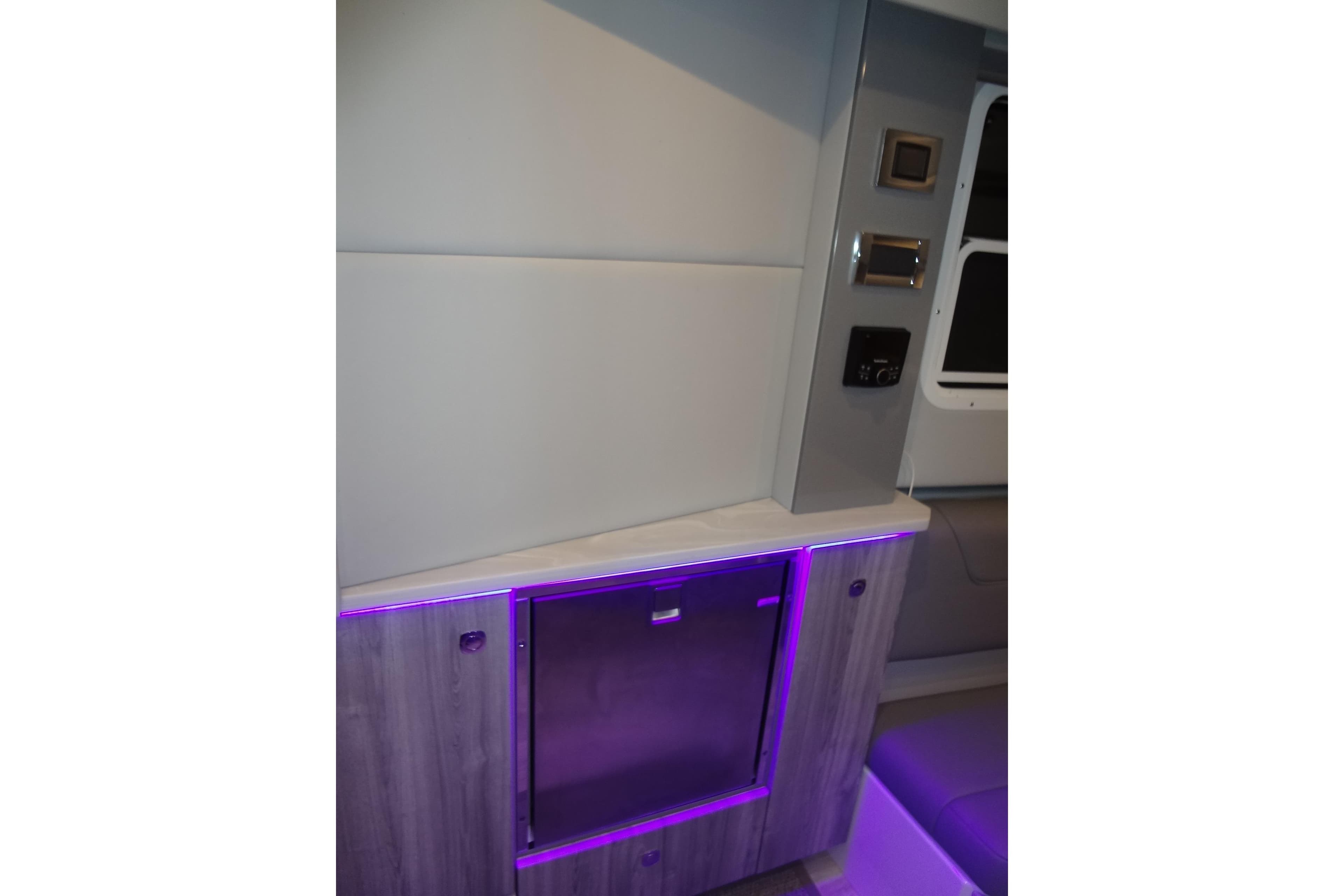 Interior of 2023 Formula 380 Super Sport Crossover with modern lighting and control panel.