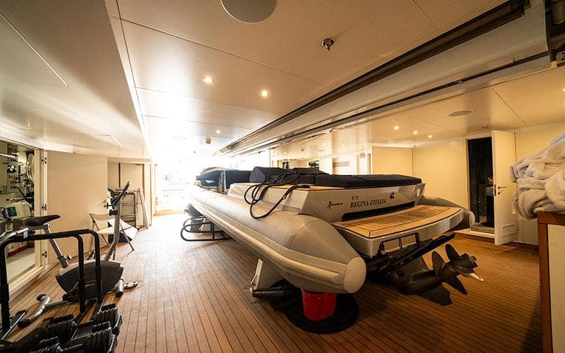 Luxurious Codecasa F74 yacht interior with inflatable boat, 2019 model.