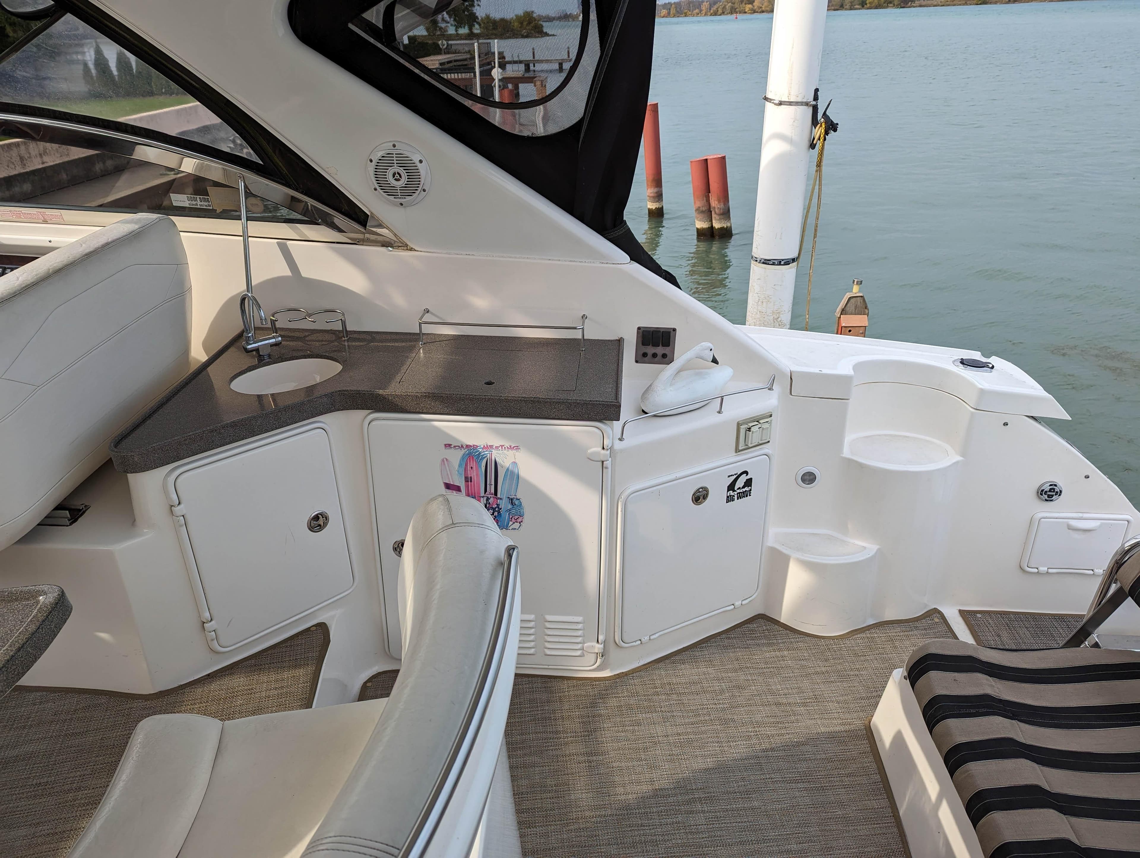 Interior of 2006 Regal 3760 Sportyacht with seating and sink area.