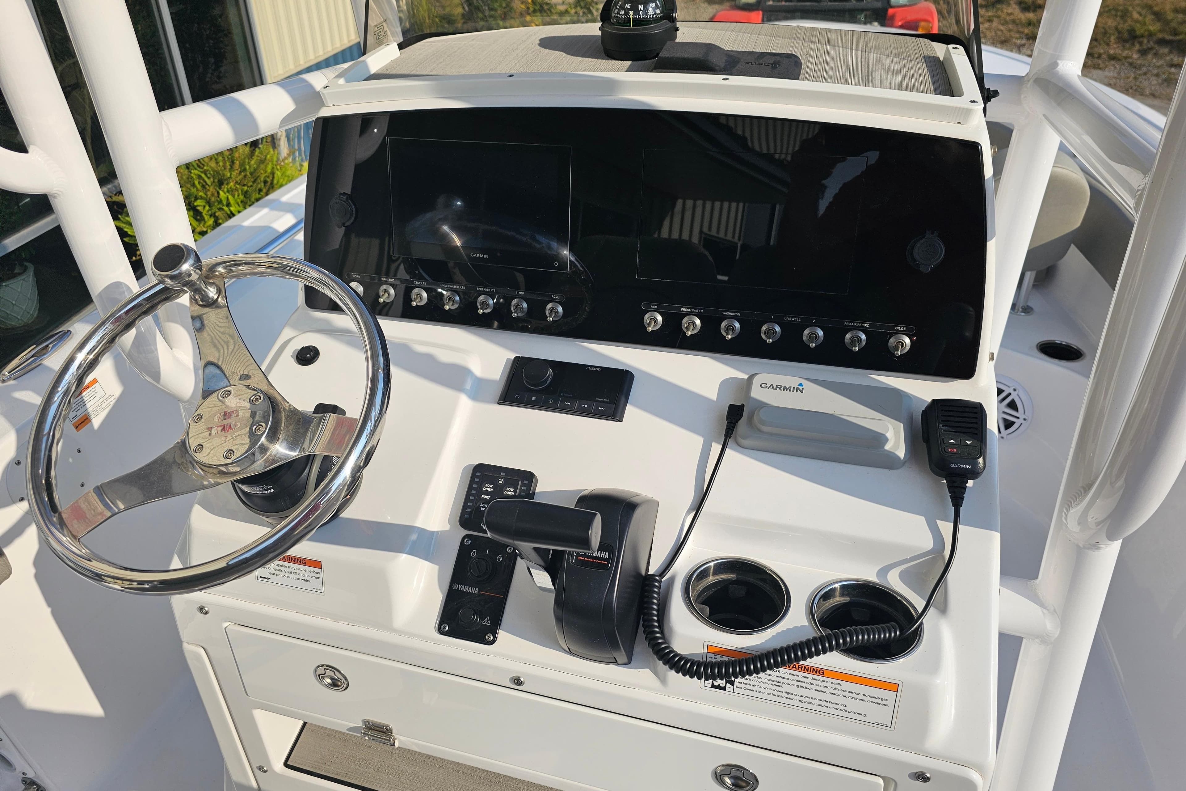 2023 Sportsman Open 212 Center Console dashboard with steering wheel and navigation controls.