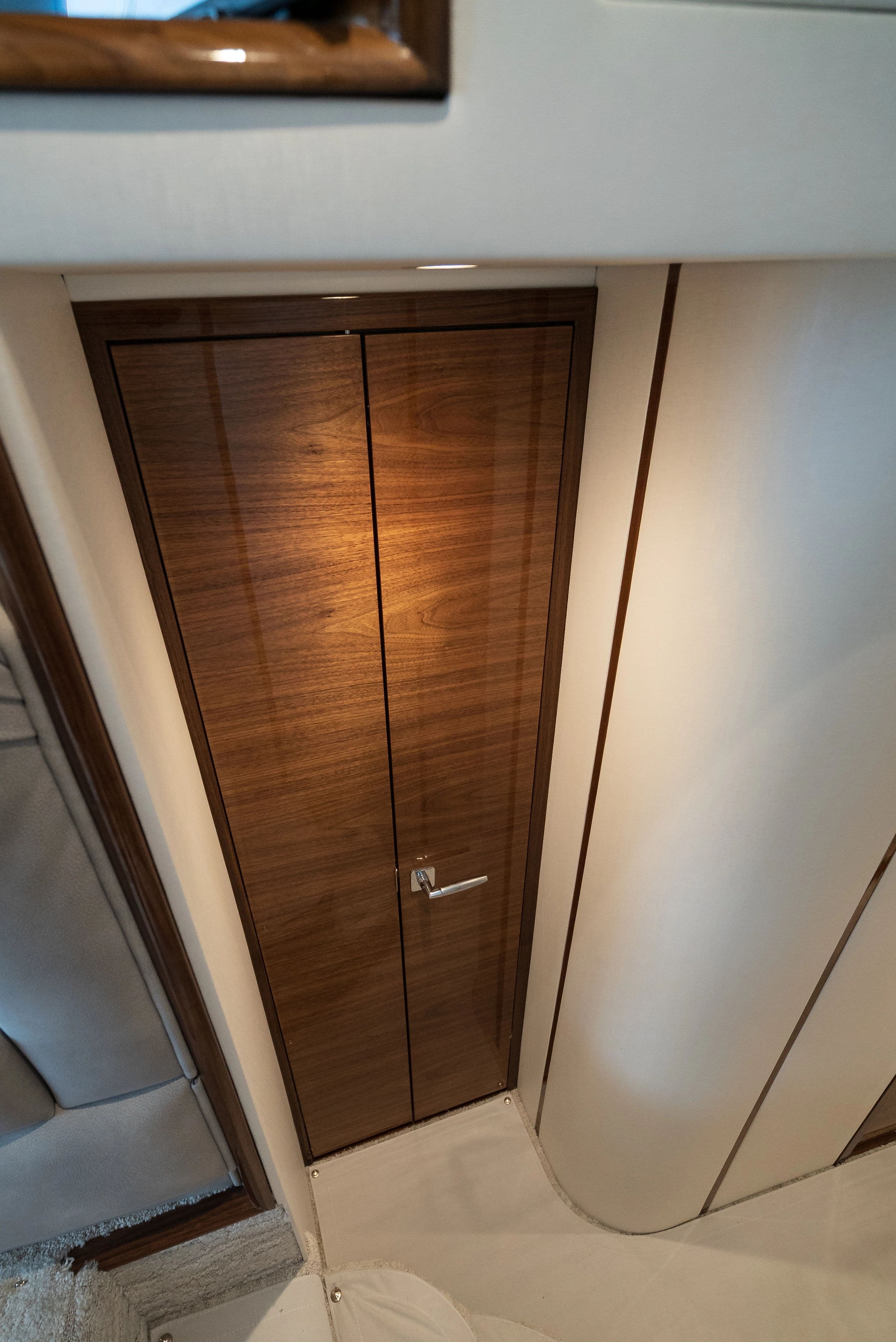 Interior of 2025 Viking 48 Convertible with wooden door.