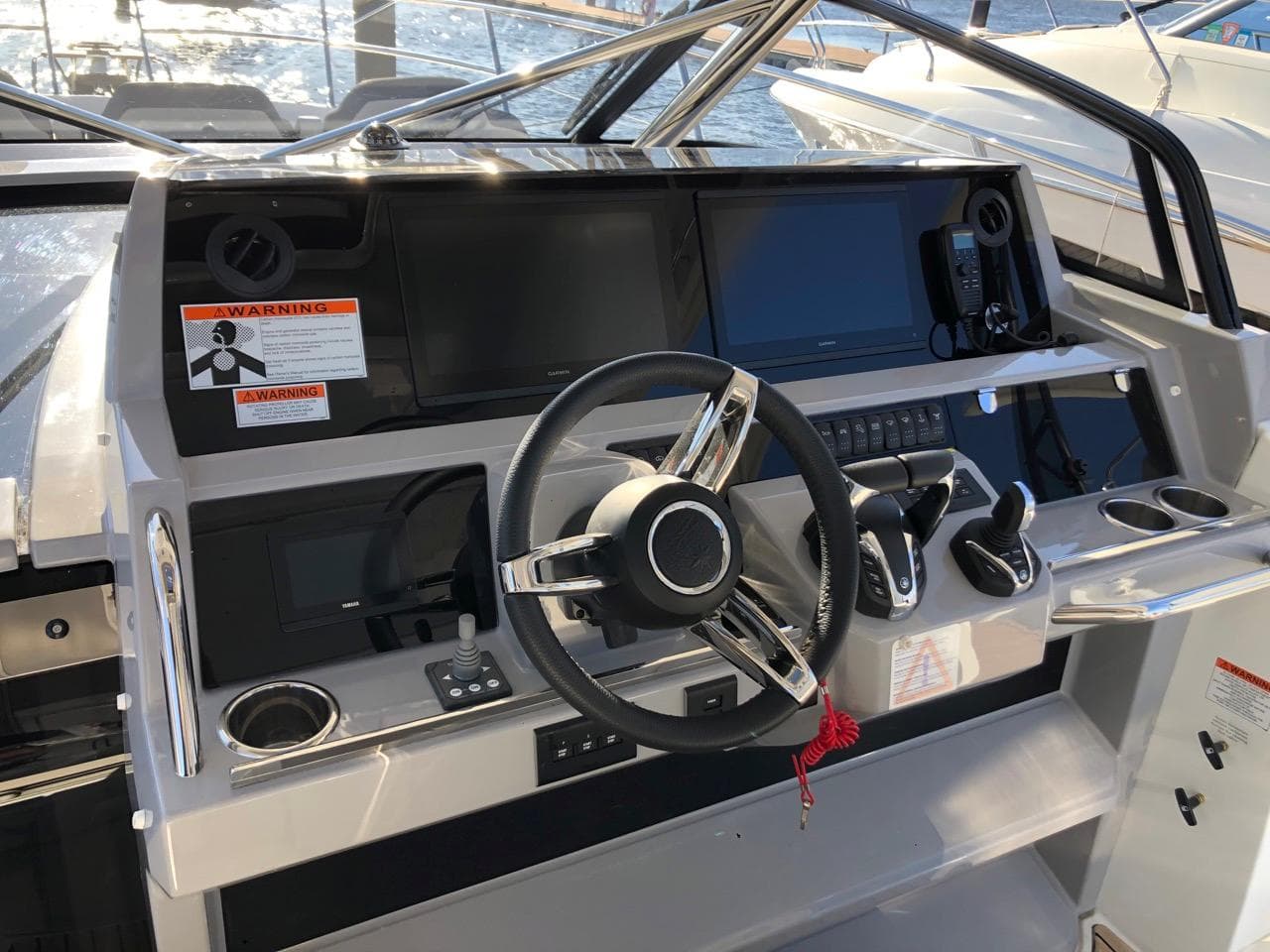 2024 Jeanneau Leader 12.5 WA helm with modern controls and navigation equipment.