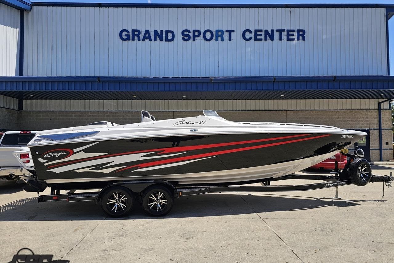 2019 Baja 27 Outlaw boat on trailer at Grand Sport Center.