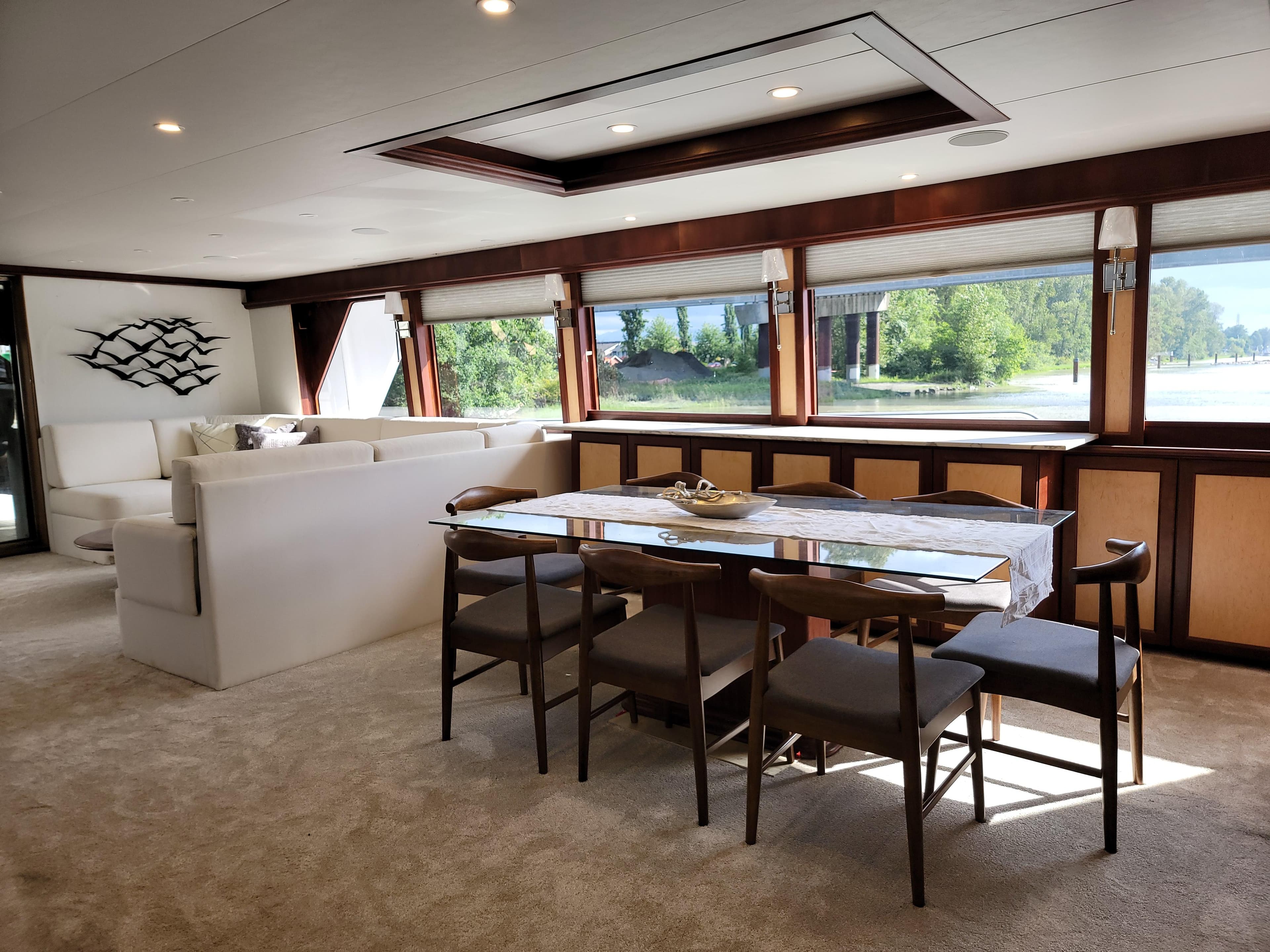 Luxurious interior of 2006 Cheoy Lee Motor Yacht Bravo Series with elegant dining area.