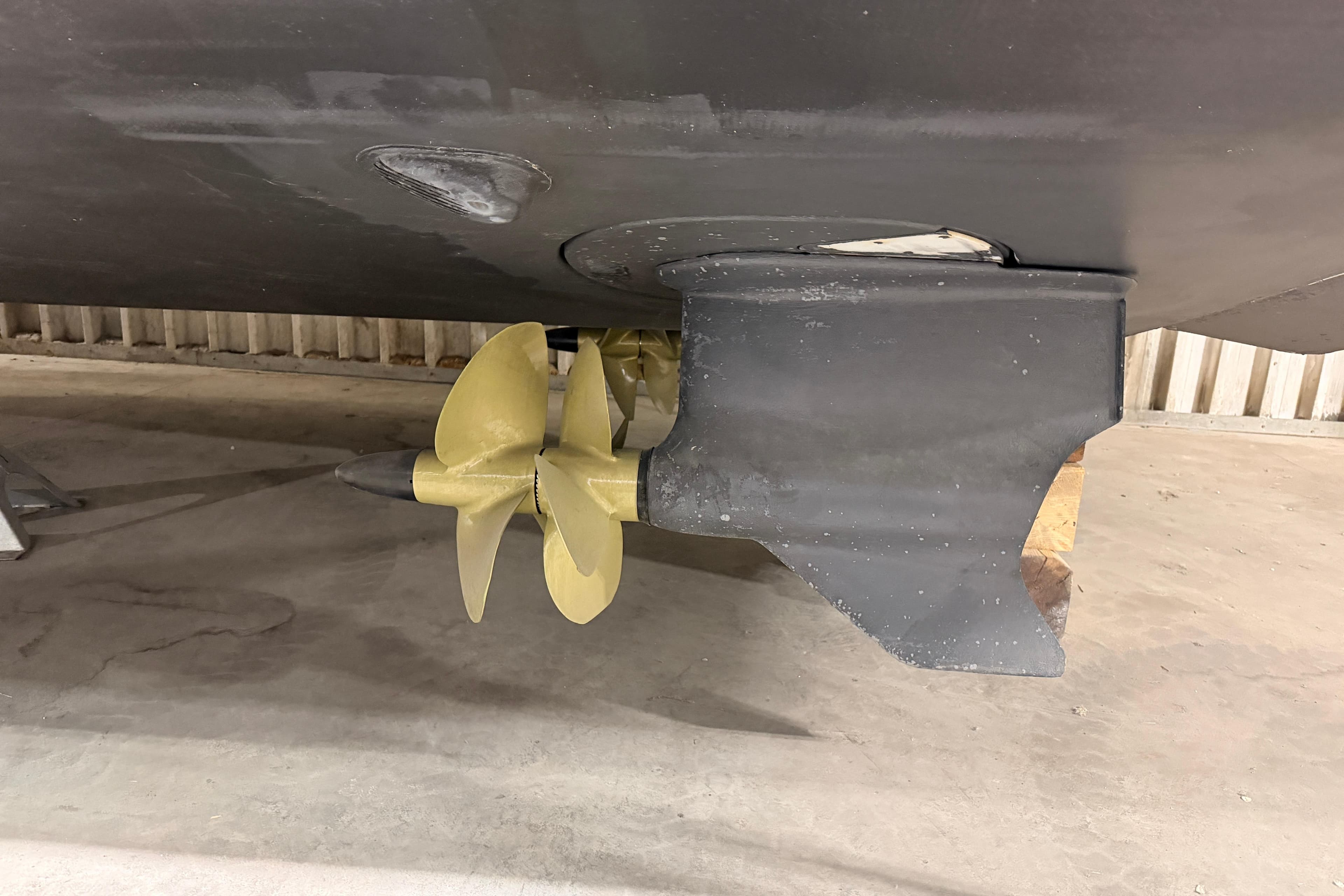 Propeller of 2019 Regal 42 Grande Coupe boat in a storage facility.