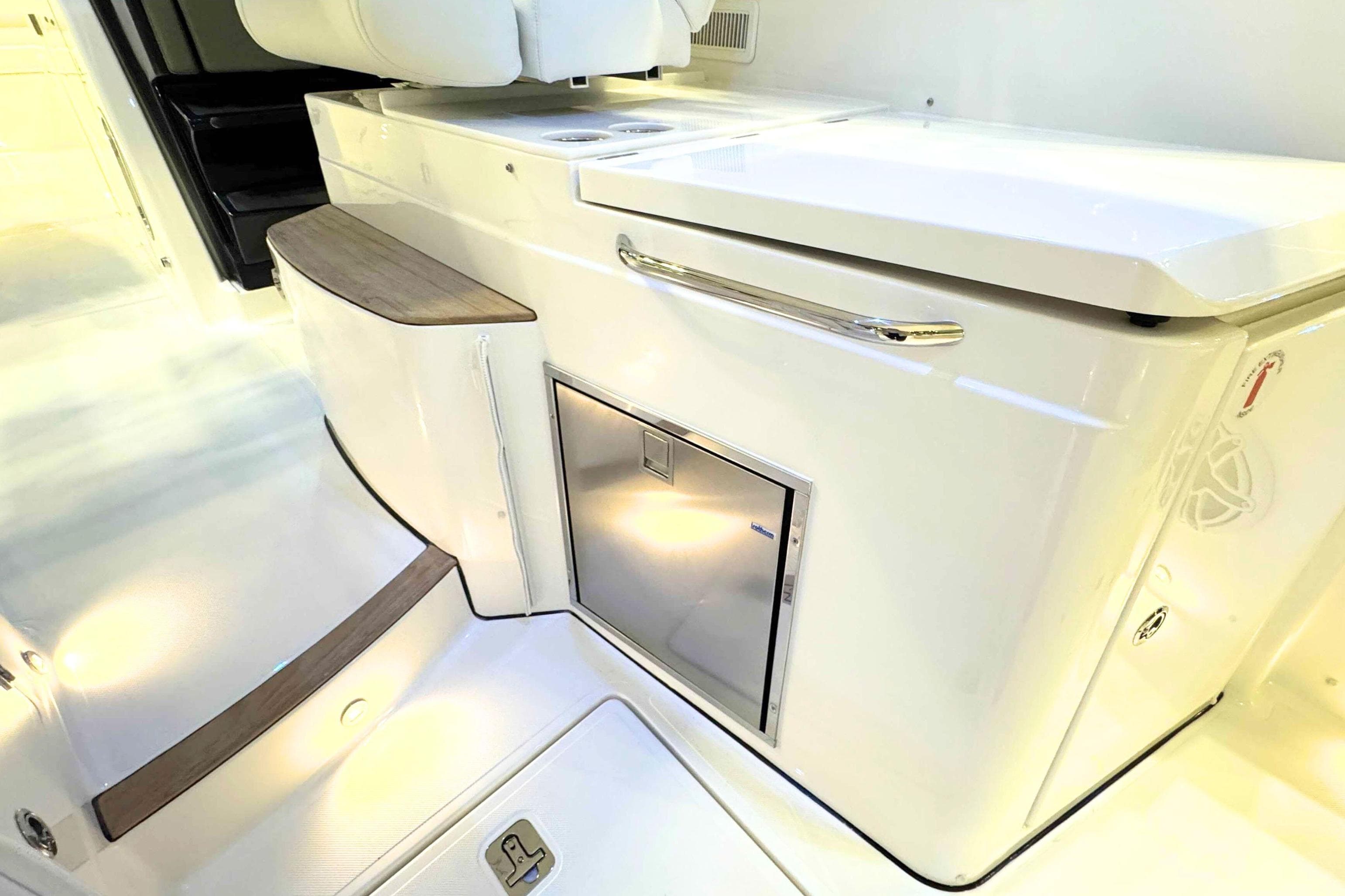 2026 Pursuit DC 365 Dual Console interior with sleek cabinetry and modern design.