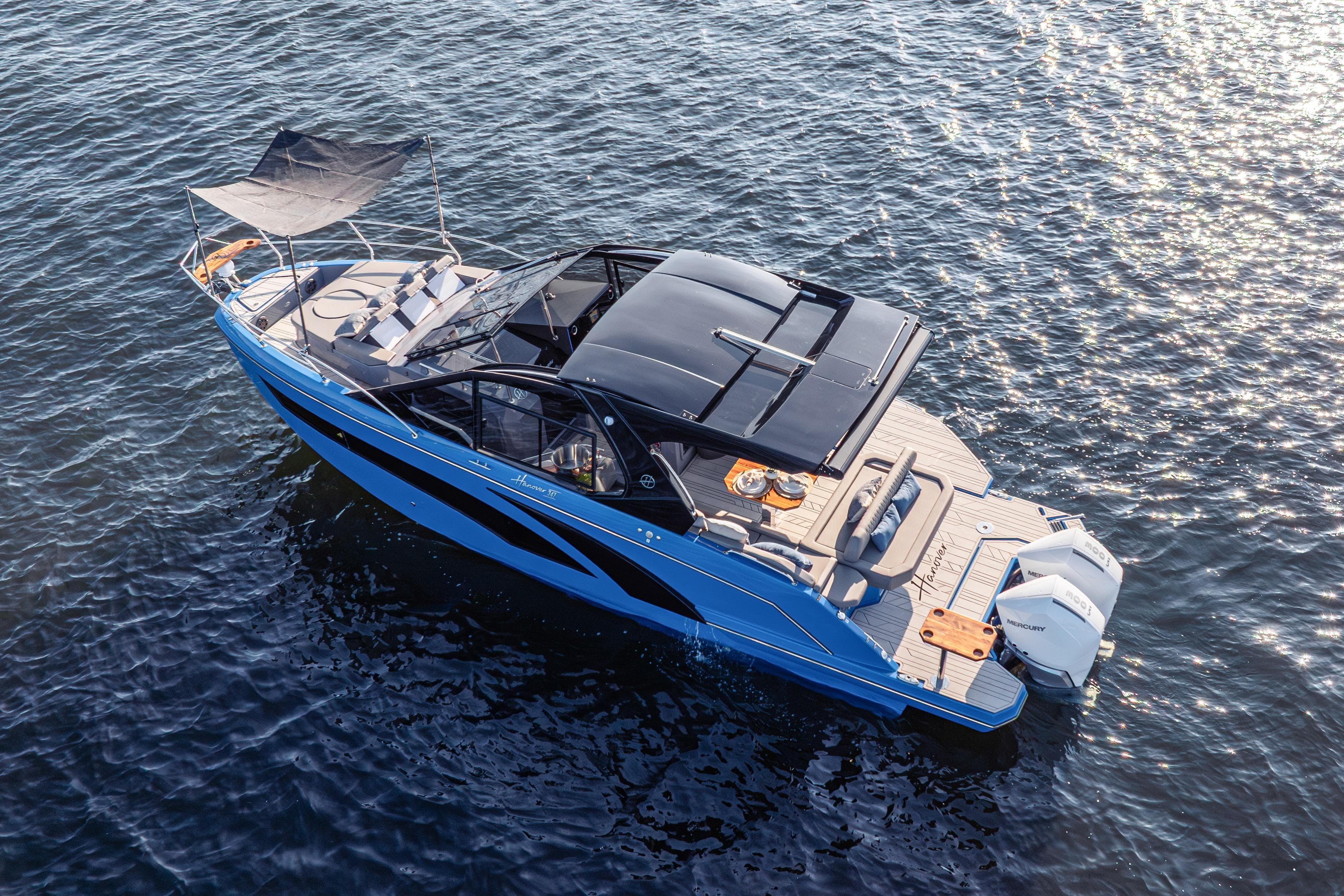 2026 Hanover 347 boat on water, featuring sleek design and modern amenities.