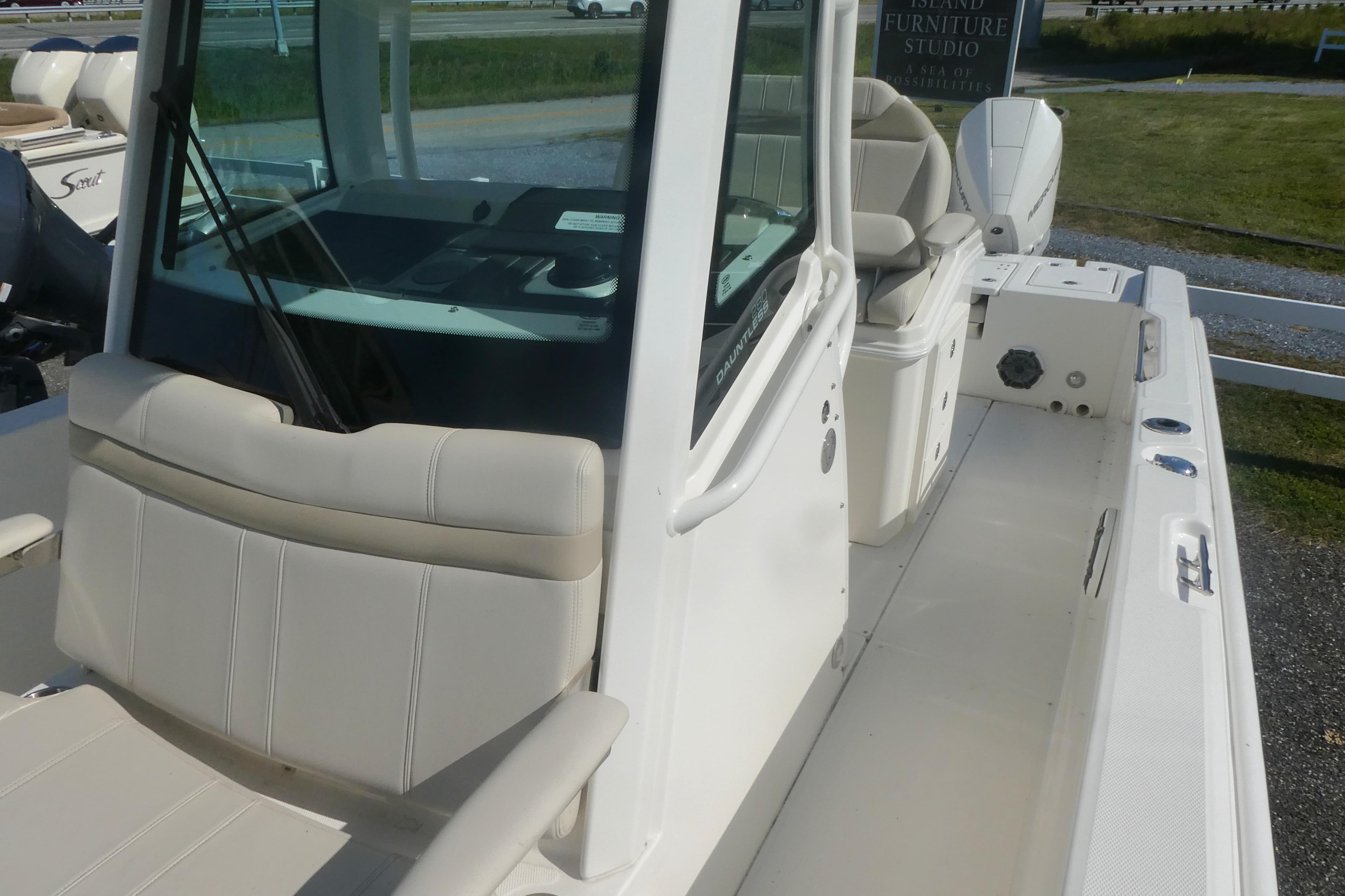 2023 Boston Whaler 280 Dauntless boat interior with seating and console.