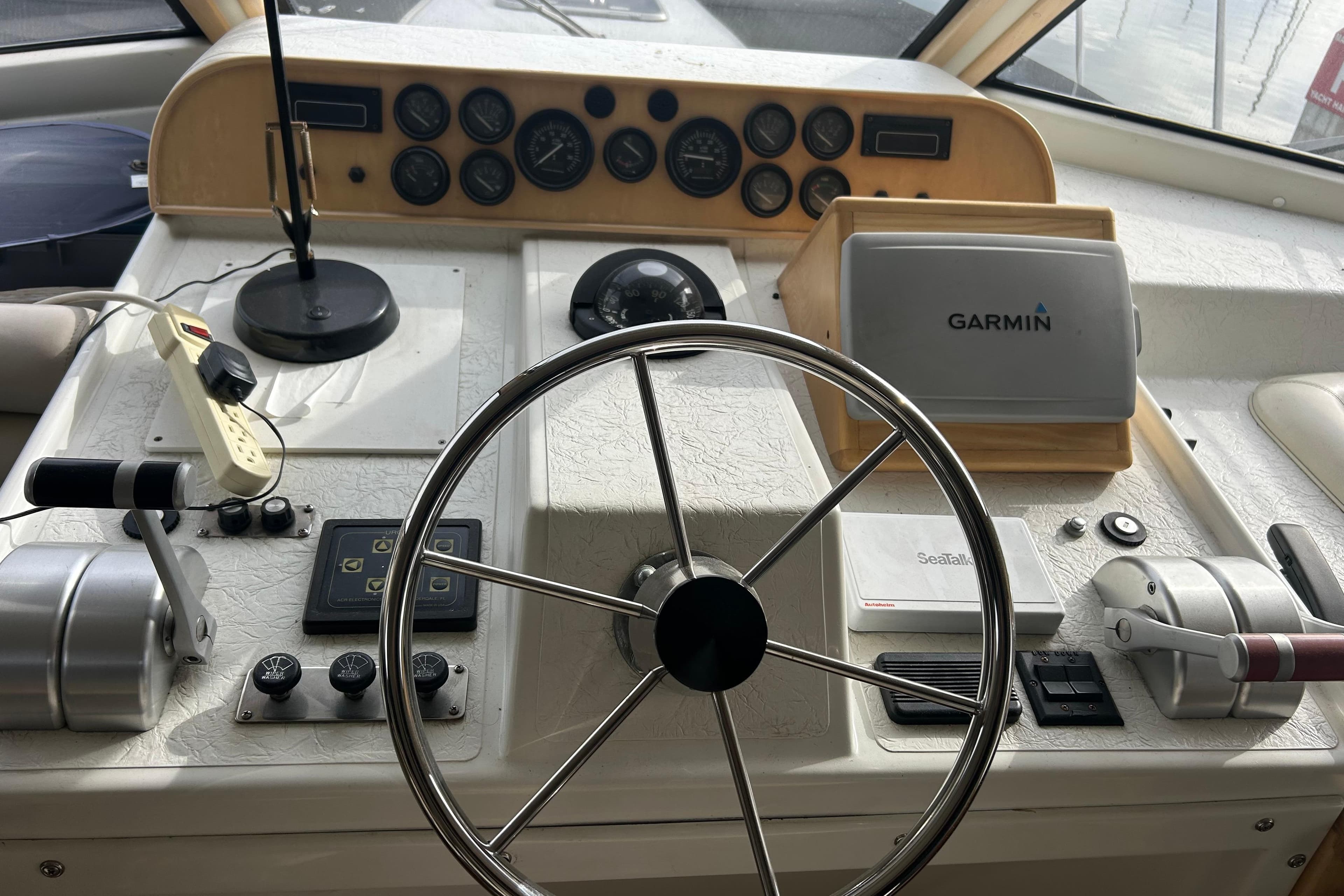 Navigator 53 Classic 1996 yacht helm with Garmin navigation system and steering wheel.