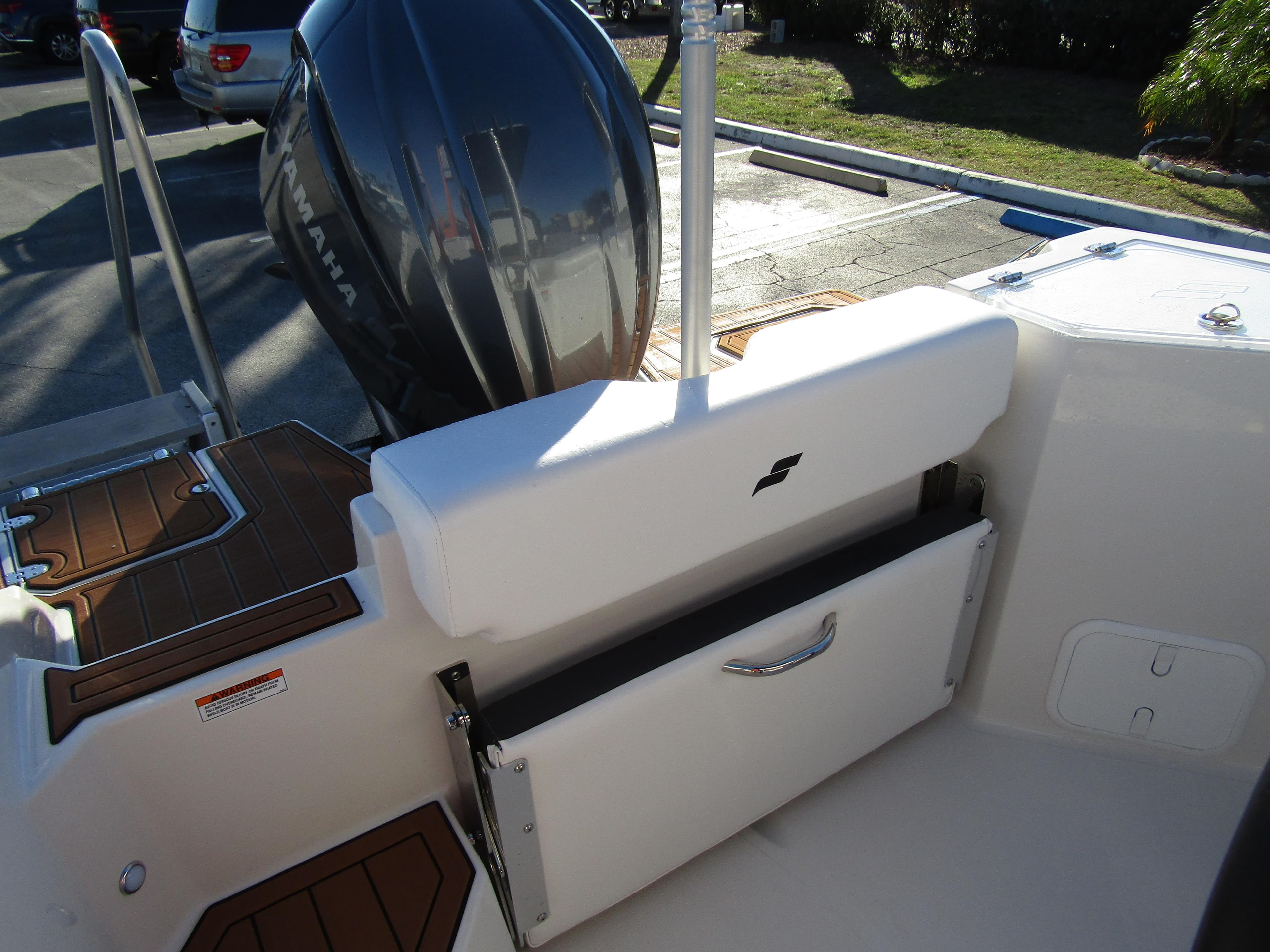 2024 Starcraft SVX 231 OB CC boat with Yamaha outboard motor and foldable bench seat.