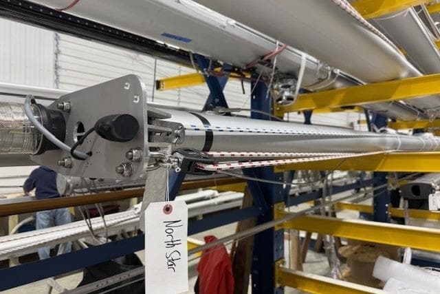 1968 Hinckley Pilot 35 sailboat mast in workshop, labeled "North Star."