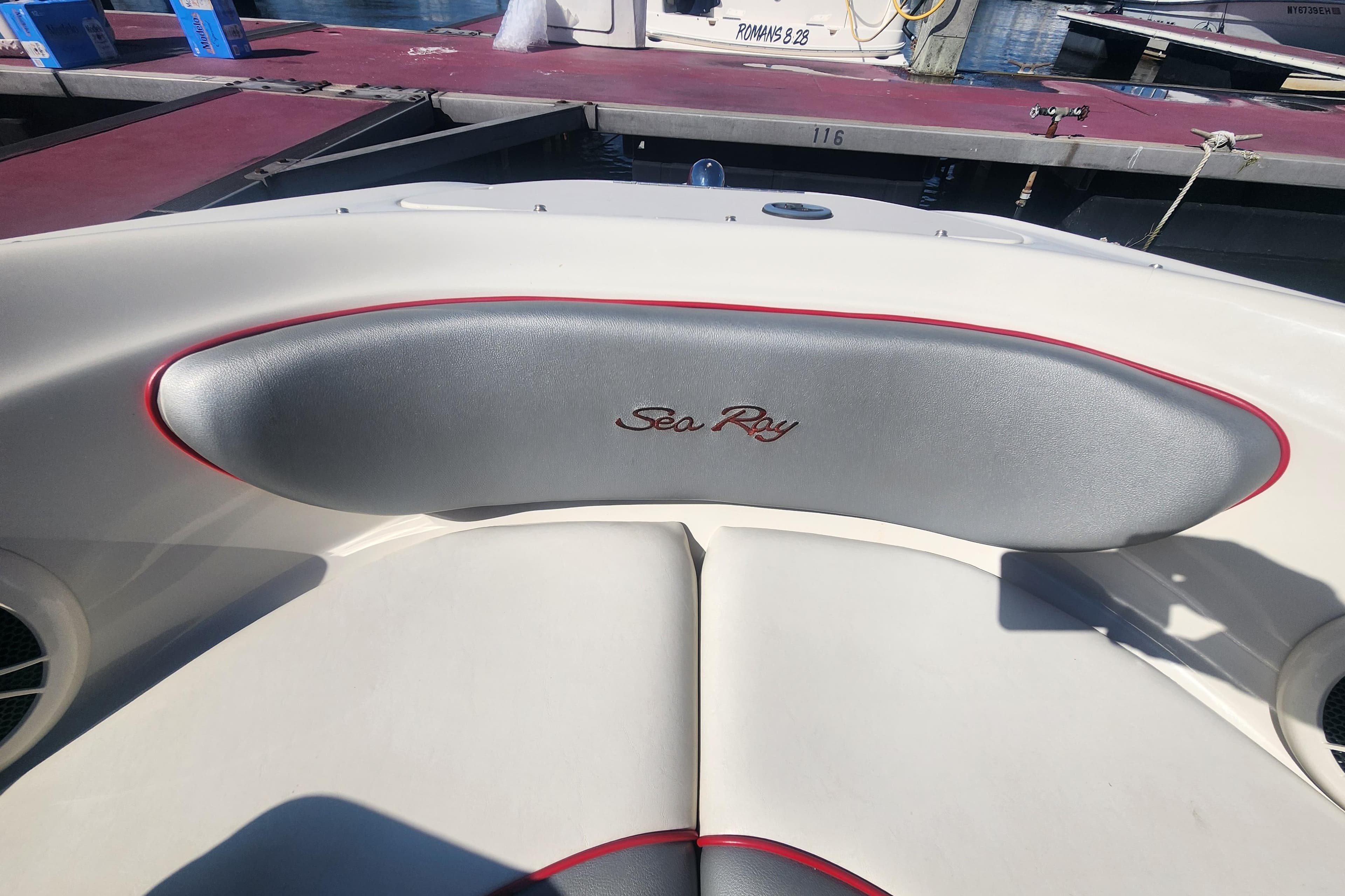 2008 Sea Ray 205 Sport boat interior with logo, docked at marina.
