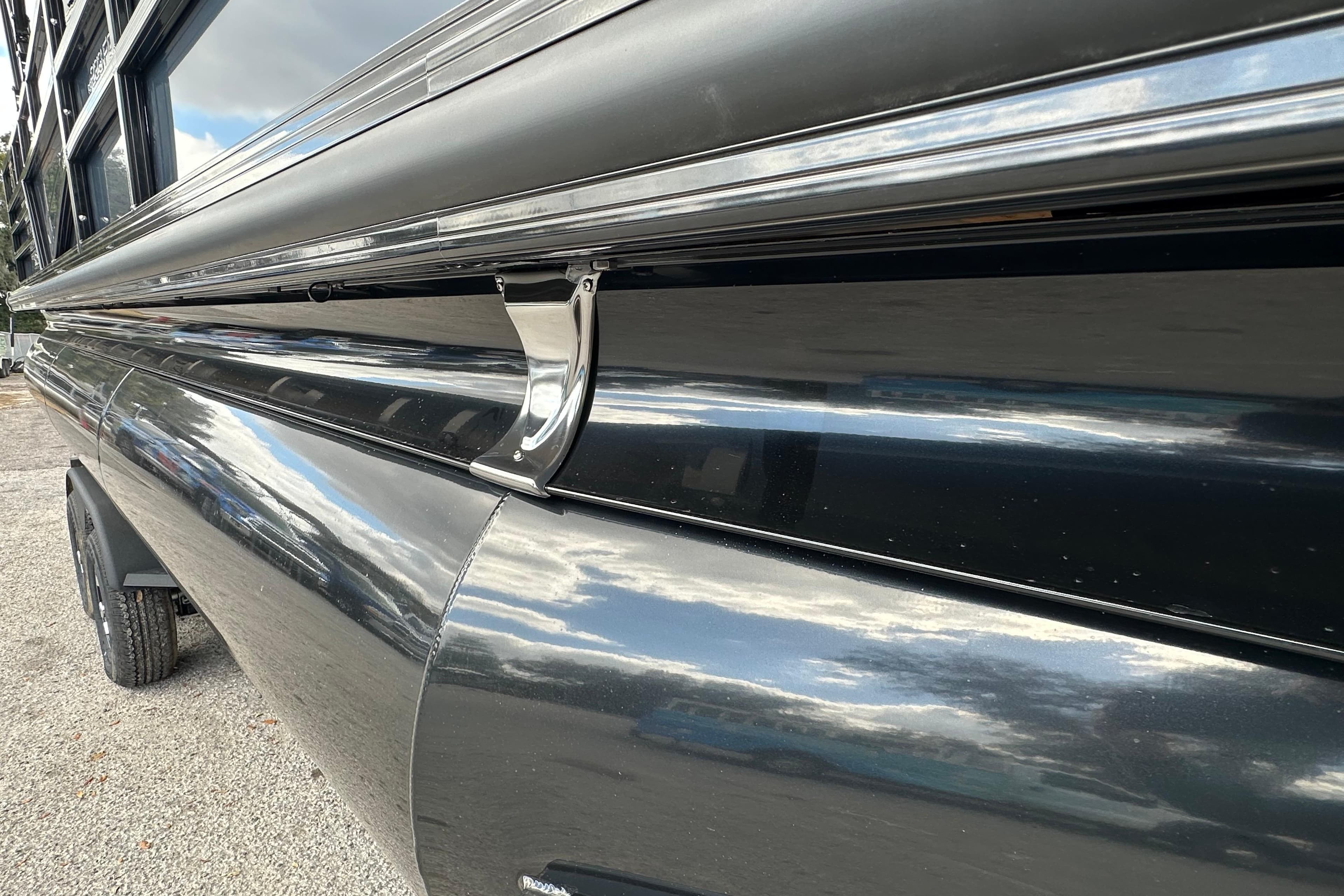 2026 Ranger Reata 223FC boat exterior with sleek black finish and chrome details.