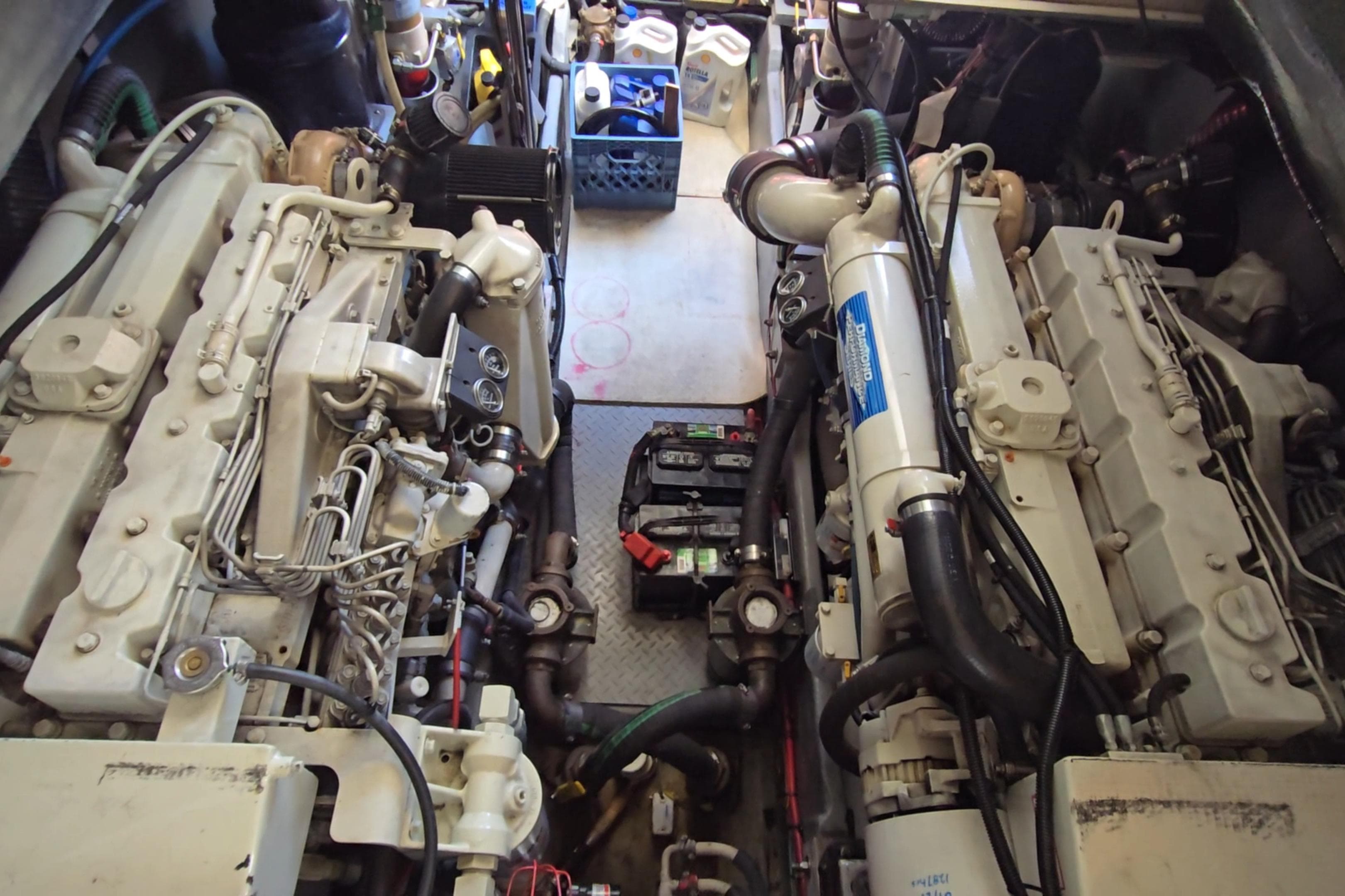 Engine room of a 2001 Sea Ray 400 Sedan Bridge with visible machinery and components.