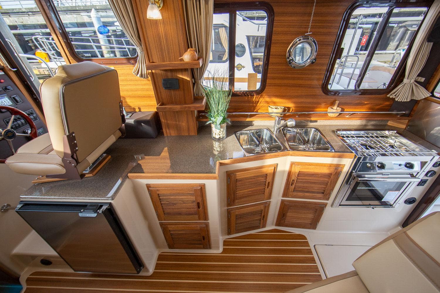 Manufacturer Provided Image: Luxurious 2025 Ranger Tugs R-31 CB interior with modern kitchen and wood accents.